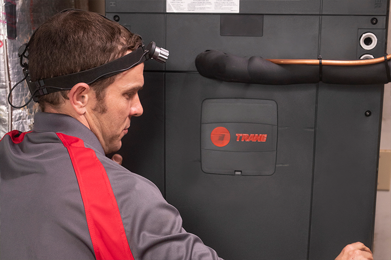 Trane tech installing heating unit