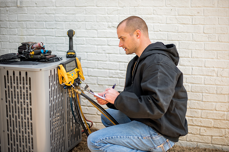 Trane tech testing AC unit